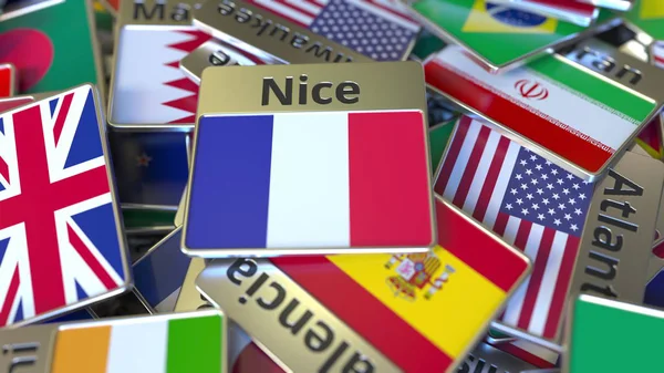 Souvenir magneet of badge met mooie tekst en nationale vlag onder verschillende. Reizen naar Frankrijk conceptuele 3D-rendering — Stockfoto