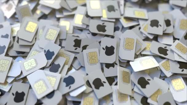 Купа SIM-карт з логотипом Apple Inc, Крупний план. Редакційні телекомунікації пов'язані 3D-анімації — стокове відео