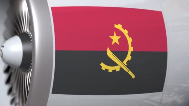 Vliegtuig motor met vlag van Angola. Angolese luchtvervoer conceptuele 3D-animatie — Stockvideo