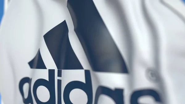 Mengibarkan bendera dengan logo Adidas, close-up. Perenderan 3D Editorial — Stok Foto