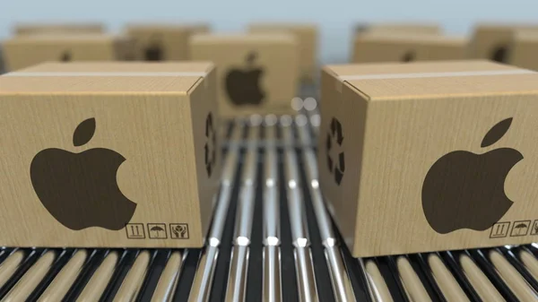 Las cajas de cartón con logotipo de APPLE INC se mueven en el transportador de rodillos. Representación 3D realista —  Fotos de Stock