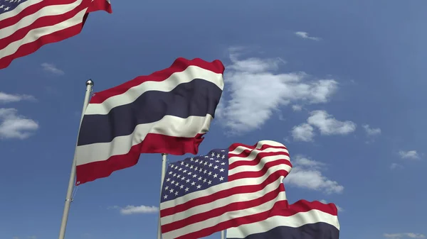 Banderas de Tailandia y Estados Unidos contra el cielo azul, representación 3D —  Fotos de Stock
