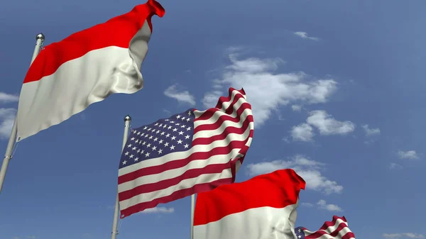 Флаги Индонезии и США против голубого неба, 3D рендеринг — стоковое фото