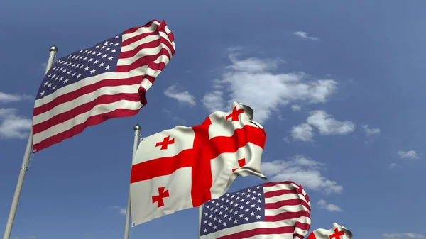 Zwaaiende vlaggen van Georgië en de VS op Sky achtergrond, 3D rendering — Stockfoto