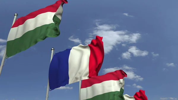 Fila de banderas ondeantes de Hungría y Francia, representación 3D — Foto de Stock