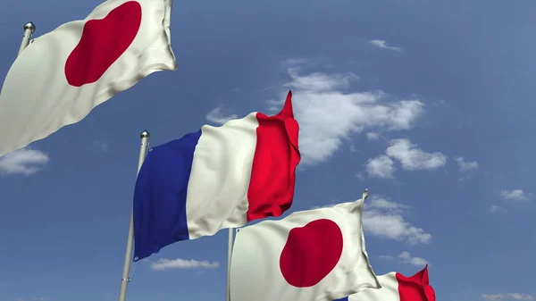 Viele Flaggen von Japan und Frankreich, 3D-Darstellung — Stockfoto