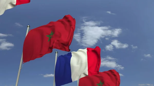 Sventolando bandiere di Marocco e Francia su sfondo cielo, rendering 3D — Foto Stock