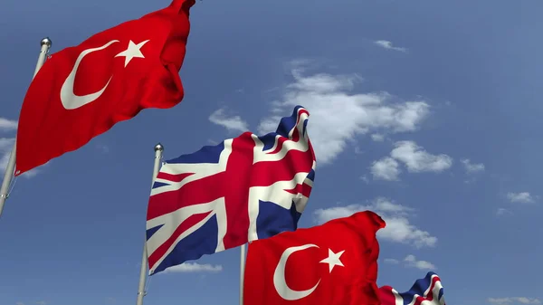 Размахивание флагами Турции и Великобритании, 3D рендеринг — стоковое фото