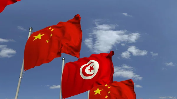 Mnoho praporků Tuniska a Číny, prostorové vykreslování — Stock fotografie