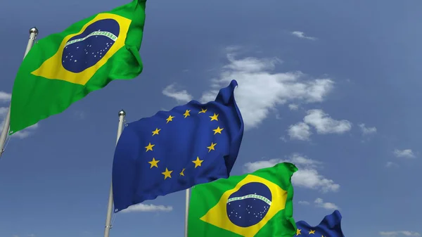 Acenando bandeiras do Brasil e da UE no fundo do céu, renderização 3D — Fotografia de Stock