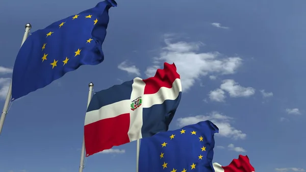 Σημαίες της Δομινικανική Δημοκρατίας και της Ευρωπαϊκής Ένωσης σε διεθνή συνάντηση, απόδοση 3D — Φωτογραφία Αρχείου