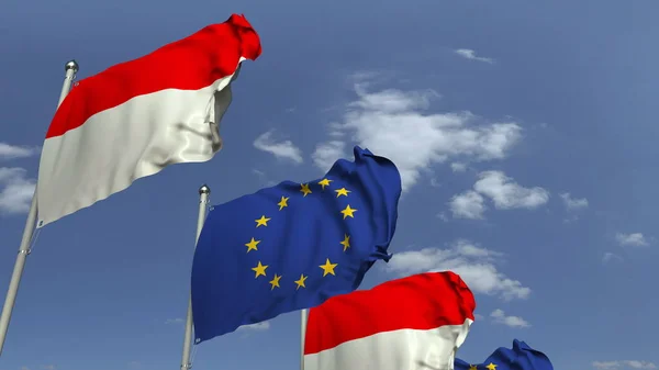 Banderas de Indonesia y la Unión Europea contra el cielo azul, representación 3D — Foto de Stock