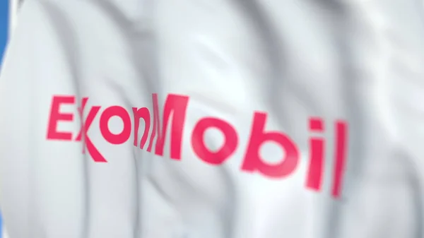 Exxon Mobil Corporation logosu ile bayrak sallayarak, yakın çekim. Editoryal 3d render — Stok fotoğraf