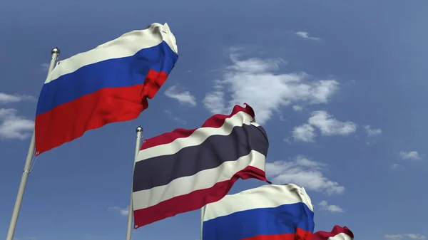 Banderas de Tailandia y Rusia contra el cielo azul, representación 3D — Foto de Stock