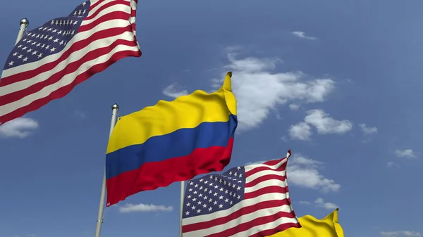Flags of Colombia and the USA against blue sky, 3D rendering — Stock Photo, Image