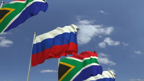 Fila de banderas ondeantes de Sudáfrica y Rusia, animación 3D loopable — Vídeo de stock