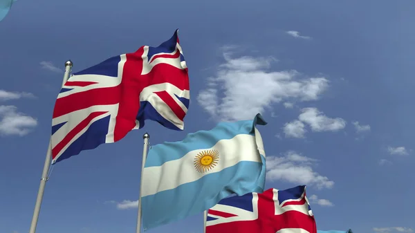 Riga di bandiere sventolanti di Argentina e Regno Unito, rendering 3D — Foto Stock