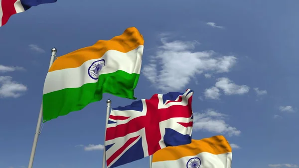 Ряд размахивания флагами Индии и Великобритании, 3D рендеринг — стоковое фото