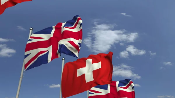 Багато прапори Швейцарії та Великої Британії, 3D-рендерінг — стокове фото