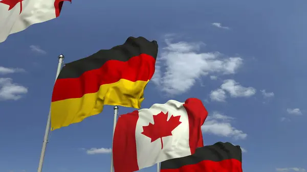 Rij van zwaaiende vlaggen van Canada en Duitsland, 3D-rendering — Stockfoto