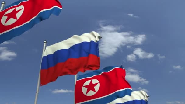 Zwaaiende vlaggen van Noord-Korea en Rusland, loop bare 3D-animatie — Stockvideo