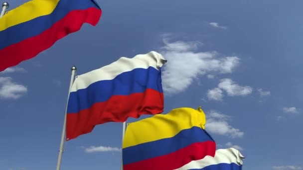 Drapeaux de la Colombie et de la Russie contre le ciel bleu, animation 3D en boucle — Video