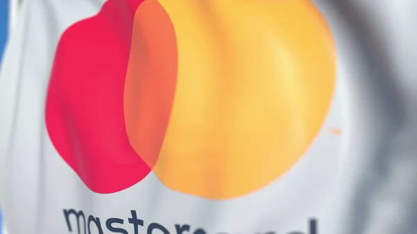 Viftande flagga med MasterCard Incorporated logo, närbild. Redaktionell 3D-rendering — Stockfoto