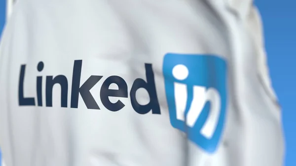 Linkedin社のロゴが入った旗を振り、クローズアップ。エディトリアル 3D レンダリング — ストック写真