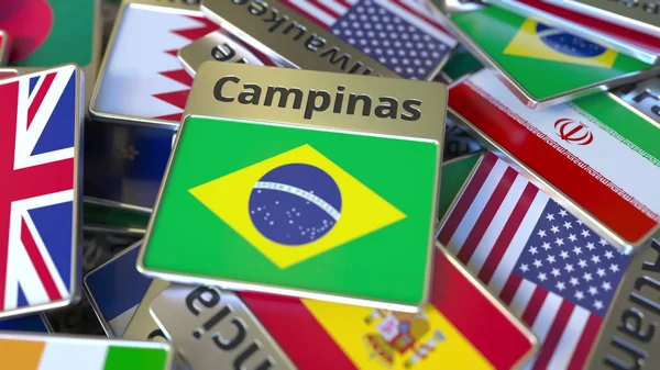 Souvenir magnet eller Badge med Campinas text och nationell flagga bland olika sådana. Resa till Brasilien Konceptuell 3D-rendering — Stockfoto