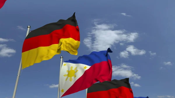 Bandeiras ondulando das Filipinas e da Alemanha, renderização 3D — Fotografia de Stock