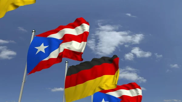 Waving flags of Puerto Rico and Germany, 3D rendering — Stock Photo, Image