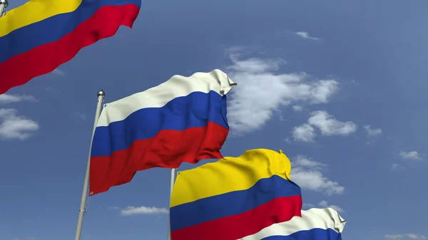 Bandeiras da Colômbia e da Rússia contra o céu azul, renderização 3D — Fotografia de Stock
