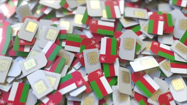 Multiple SIM cards with flag of Oman. Omani mobile telecommunications conceptual 3D animation — Stock Video