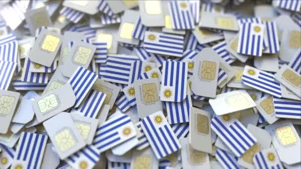 Múltiples tarjetas SIM con bandera de Uruguay. Animación 3D conceptual de telecomunicaciones móviles uruguayas — Vídeos de Stock