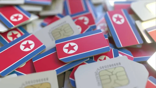 Cartões SIM com bandeira da Coreia do Norte. Rede celular coreana relacionado renderização 3D conceitual — Fotografia de Stock