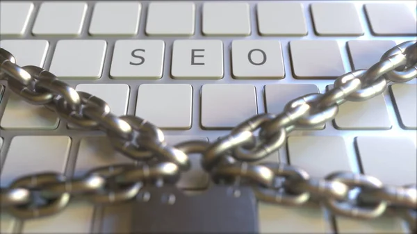 SEO word on the keyboard with padlock and chains. Conceptual 3D rendering — Stock Photo, Image