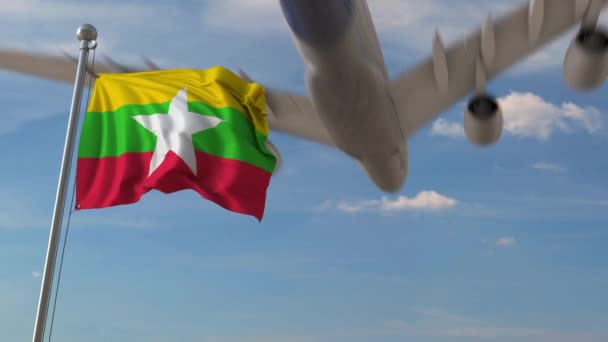 Aereo che sorvola la bandiera del Myanmar. Animazione 3D correlata al turismo Myanma — Video Stock