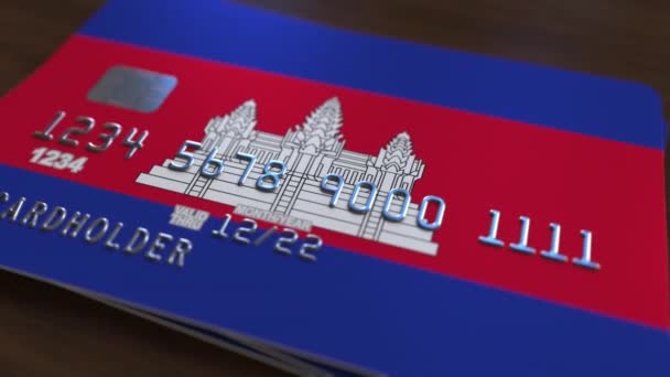 Plastic bank card featuring flag of Cambodia. Cambodian national banking system related animation — Stock Video