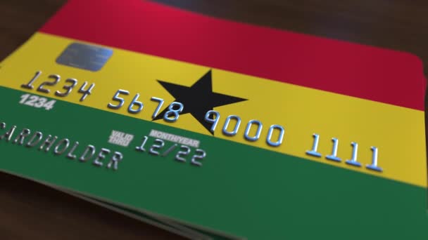 Tarjeta bancaria de plástico con bandera de Ghana. Animación relacionada con el sistema bancario nacional ghanés — Vídeo de stock