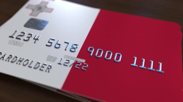 Plastic bank card featuring flag of Malta. Maltese national banking system related animation — Stock Video