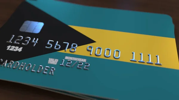 Plastic bank card featuring flag of Bahamas. Bahamian national banking system related 3D rendering