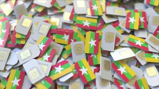 Many SIM cards with flag of Myanmar. Myanma mobile telecommunications related 3D animation — Stock Video