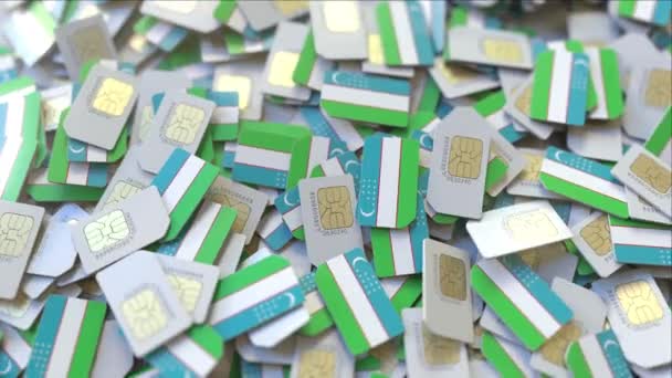 Muchas tarjetas SIM con bandera de Uzbekistán. Animación 3D relacionada con las telecomunicaciones móviles uzbekas — Vídeos de Stock