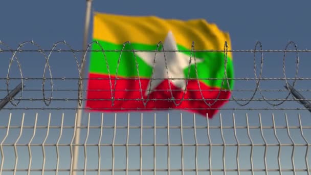 Acenando bandeira de Mianmar atrás de cerca de arame farpado. Animação 3D loopable conceitual — Vídeo de Stock
