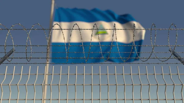 Zwaaiende vlag van Nicaragua achter prikkeldraad hek. Conceptuele 3D-rendering — Stockfoto