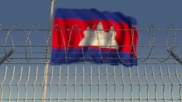 Many waving flag of Cambodia behind barbed wire fence. Conceptual 3D rendering — Stock Photo, Image