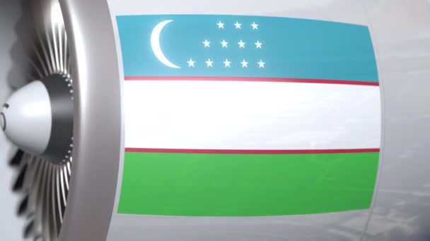 Drapeau national de l'Ouzbékistan sur moteur tourbine d'avion de ligne. Animation 3D liée à l'aviation — Video