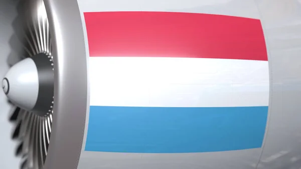 Flagge Luxemburgs auf dem Turbinentriebwerk eines Verkehrsflugzeugs. Luftfahrtbezogenes 3D-Rendering — Stockfoto