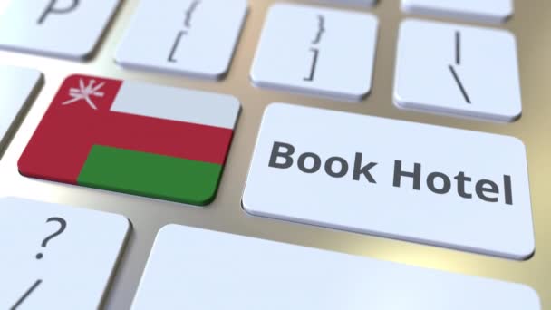 Boek Hotel tekst en vlag van Oman op de knoppen op het toetsenbord van de computer. Aan reis gerelateerde conceptuele 3D-animatie — Stockvideo