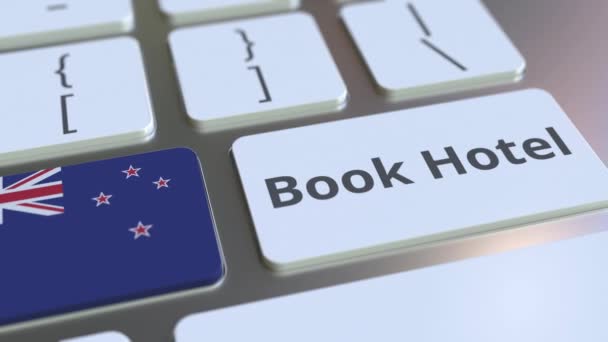 BOOK HOTEL text and flag of New Zealand on the buttons on the computer keyboard. Travel related conceptual 3D animation — Stock Video